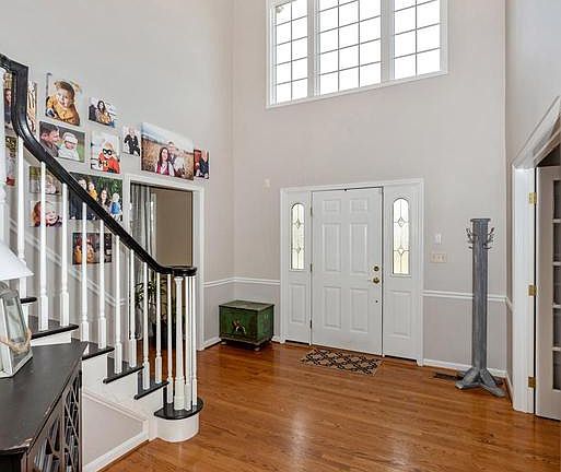 Beautiful two story foyer and orb light fixture