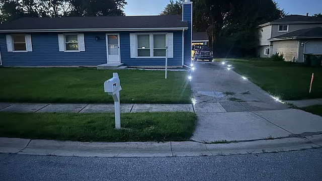 Solar lighting marking the driveway
