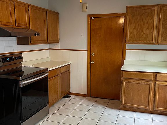 Clean kitchen with electric stove