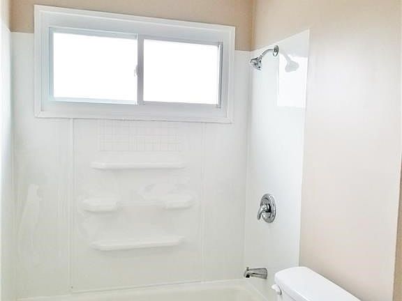 Full bath, new tub surround, stool, vanity, etc...