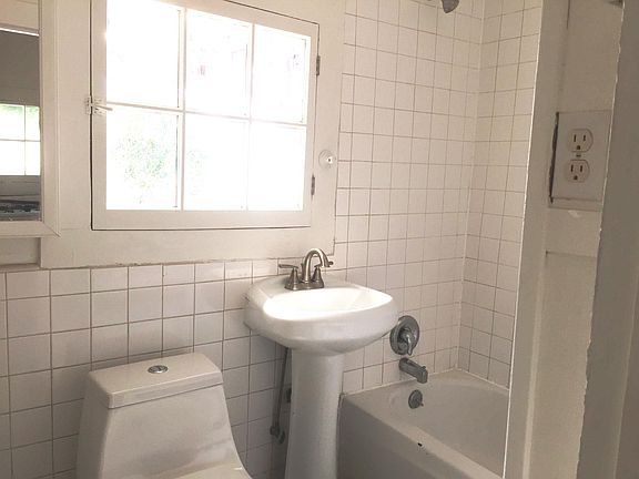     new toilet & pedestal sink in bathroom