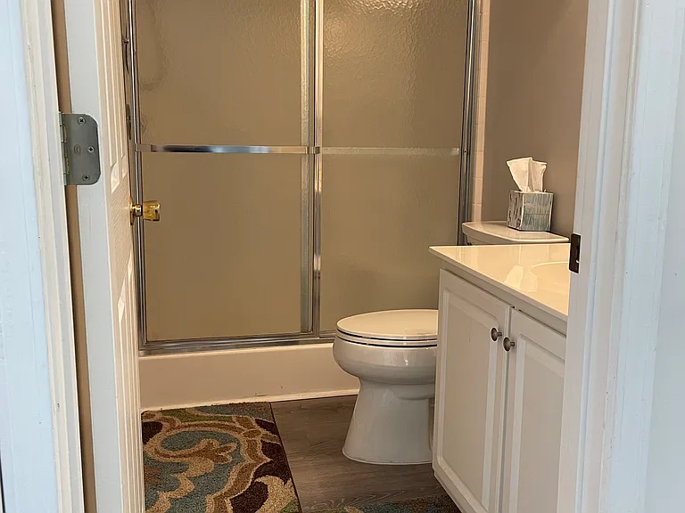 Oversized stall shower in hall bath, comfort height commodes