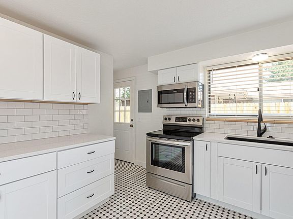 Completely updated kitchen with new cabinets new stainless steel appliances and new quartz countertops