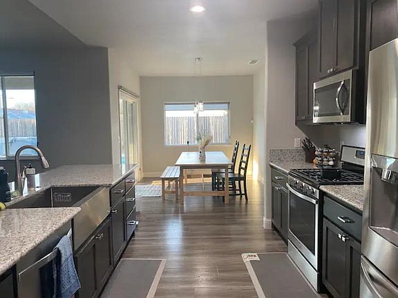 This magnificent kitchen is a chef's dream come true. With its spacious layout, high-end appliances, and beautiful cabinetry, it offers the perfect balance of form and function.