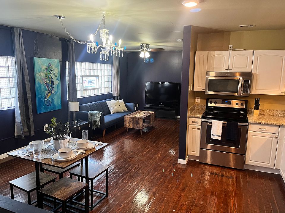 Open living room, dining room, and kitchen.