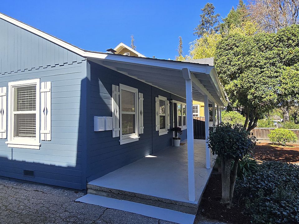Cheery blue home with white shutters. Newer double paned windows.