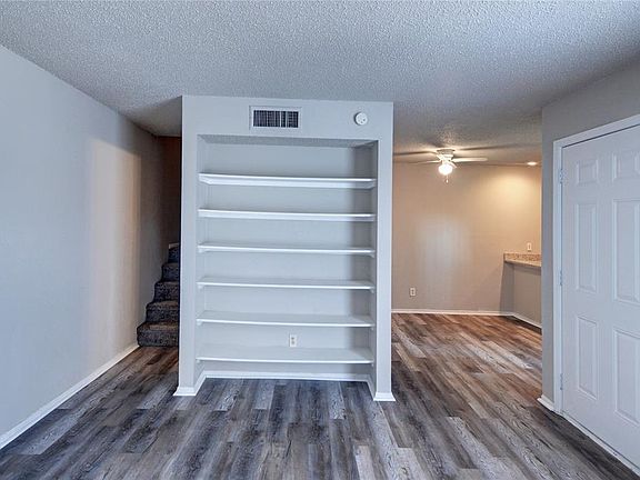LIVING ROOM WITH BUILT IN CABINET