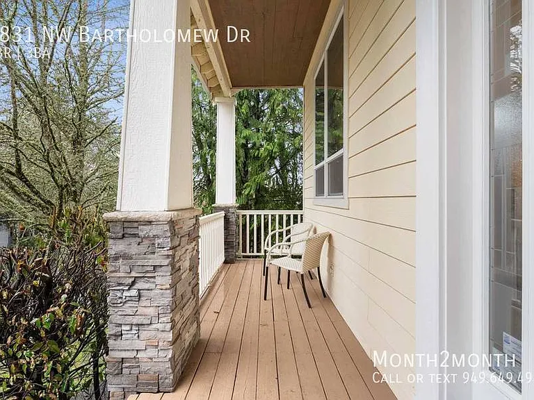 9831 NW Bartholomew Dr — Photo 33