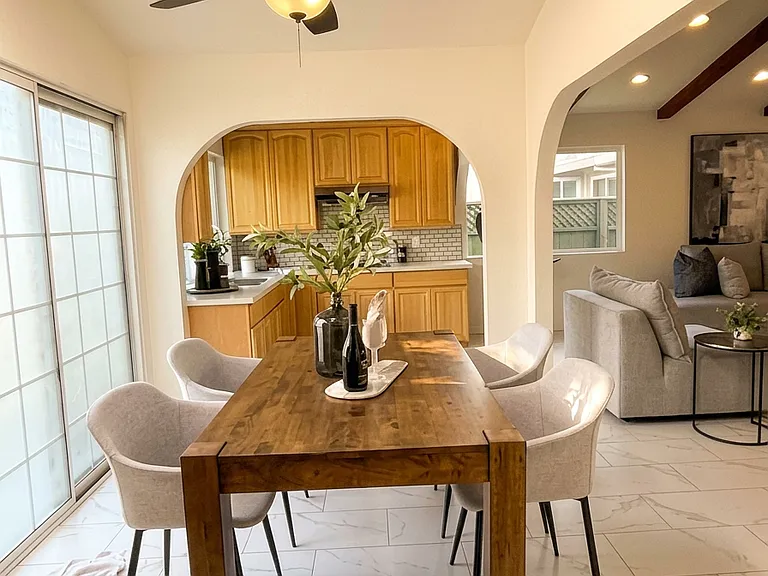 Sample furnishing of the dining area off the kitchen with skylight and direct access to the backyard