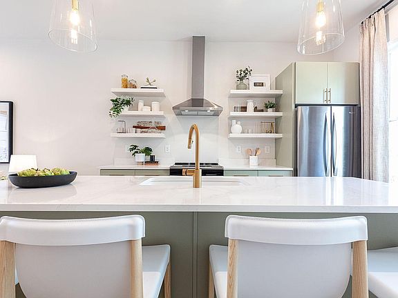 Representative photo - 2nd floor open concept kitchen, dining & living area with access to covered porch