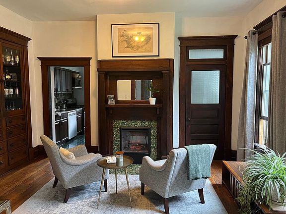 First floor flex room with built in cabinet and electric fire place