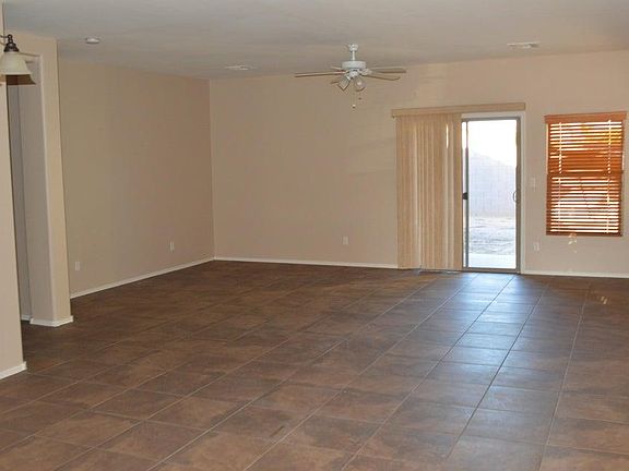 Living Room and entrance to covered patio and Turf yard.