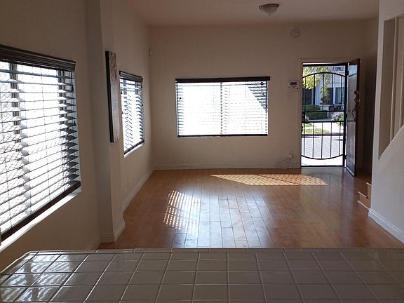 living room with faux blinds