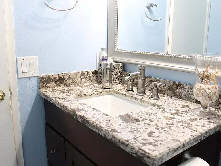 Half bath vanity with granite countertop