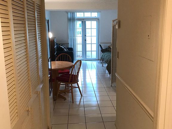 Entrance to Condo with 2 closets on left