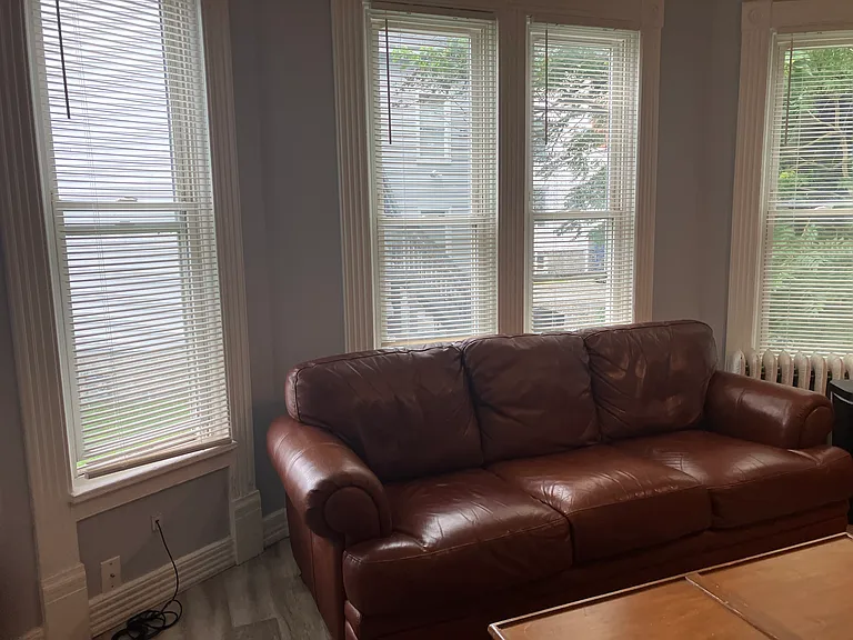 Leather coach with lots of windows