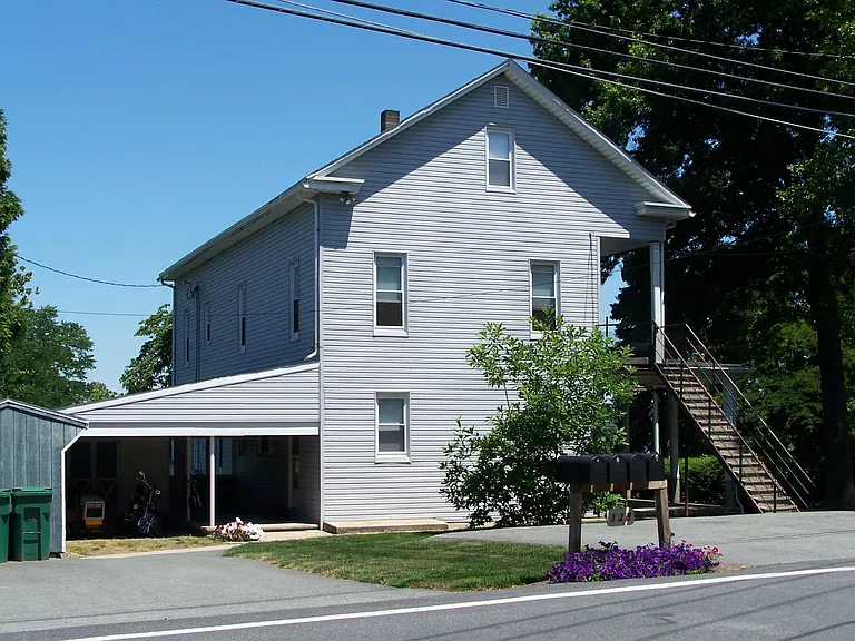 Street view; staircase to second floor.
