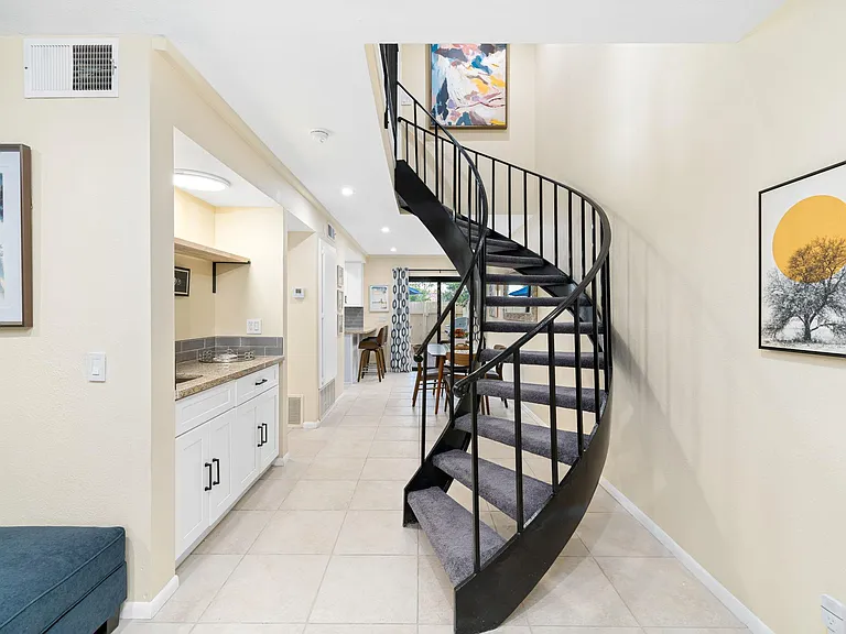Bar on left with stairs to upper level bedrooms.