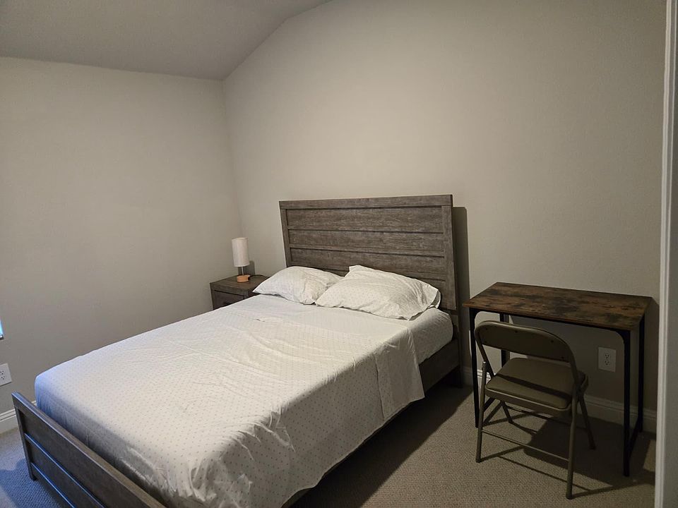 Queen size bed with desk and chair