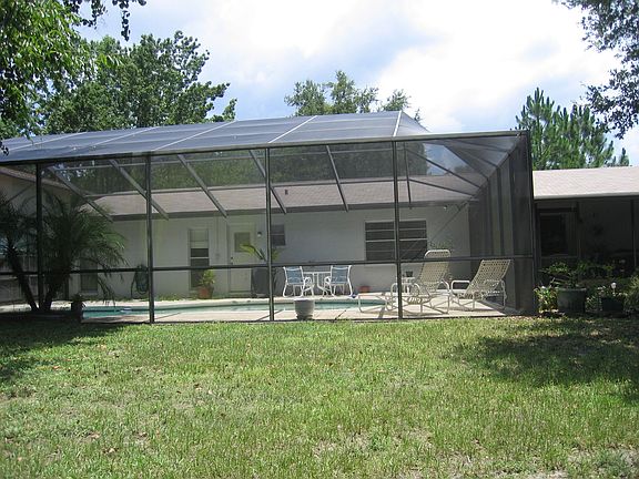 Screened Patio with Pool from Pond
