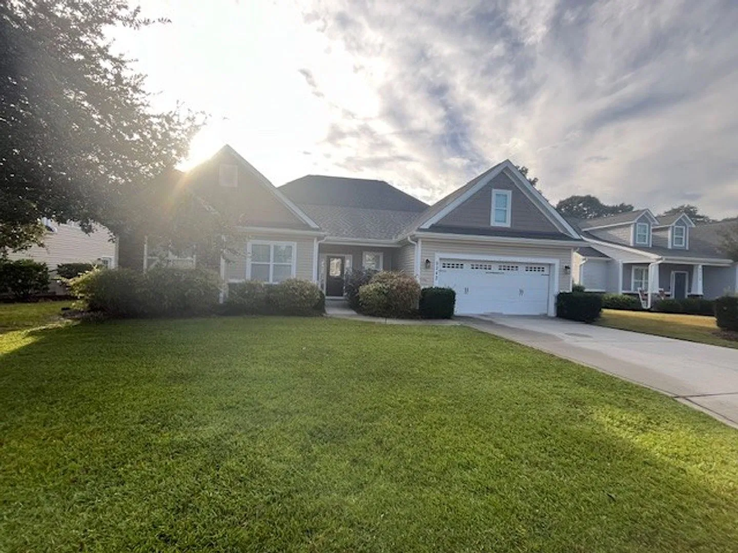 This 4-bedroom, 3-bathroom home in Porters Neck Crossing — Photo 2