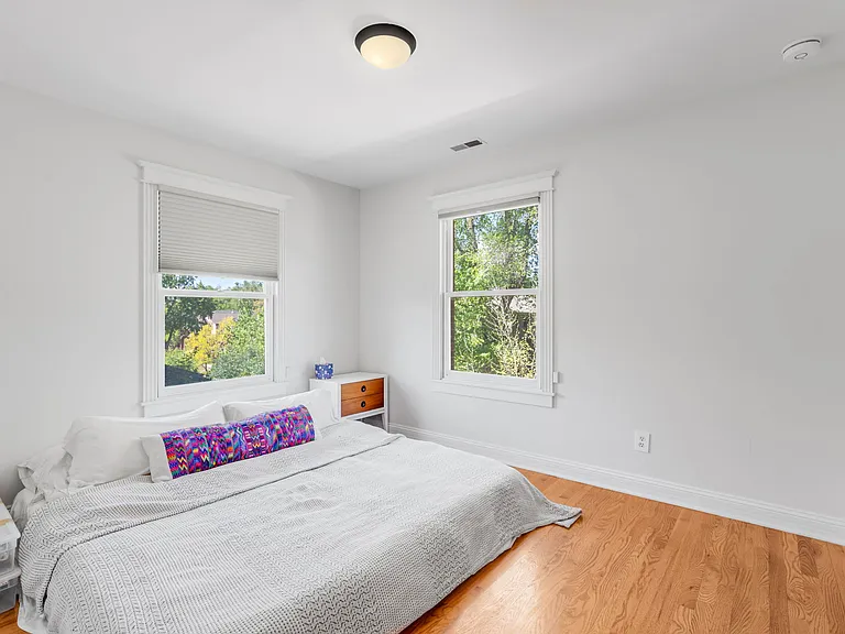 Primary Bedroom with Large Windows and Ample Light
