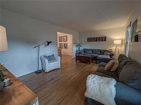 Enter the home and notice the gleaming hardwood flooring of the main level.