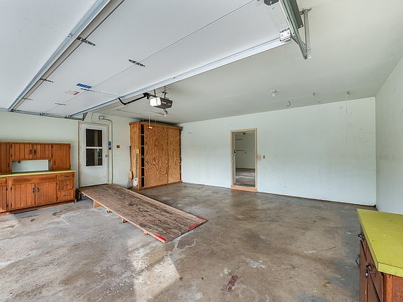 This 2.5 car garage has a ramp and assess to the 1.5 car attached garage workshop.