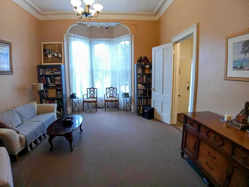 Charmingly appointed, large, Living Room with 12' ceiling and bay window