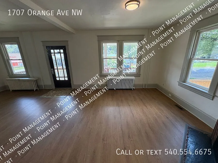 Charming 4-Bedroom Brick Home with Porch, Yard & Hardwood Floors — Photo 4