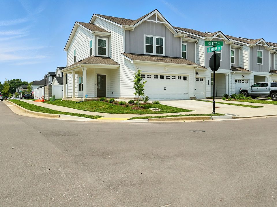 Front of house - Corner Lot with a well-maintained exterior, spacious 2-car garage, and welcoming entryway.