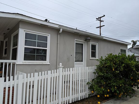 Kitchen windows closest to the camera. Laundry room door which also has access to the master bath for guest usage without passing through the master bedroom iteself. Next photo shows the patio view that the master bedroom enjoys.