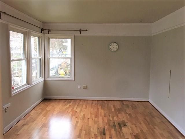 Living room. Hardwood floors are recently refinished.