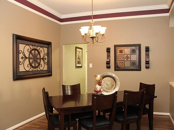 Formal dining opens to living and kitchen