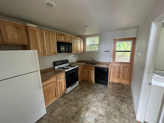 Kitchen with view of front door