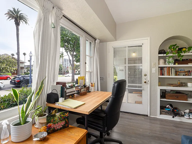 Entry Door and Sun Room Overlooking Front Lawn