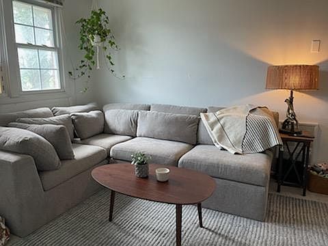 Living room shown with furniture .