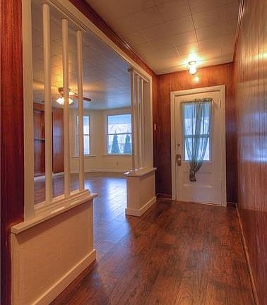 The front Foyer offers a warm greeting and view of the Living Room.