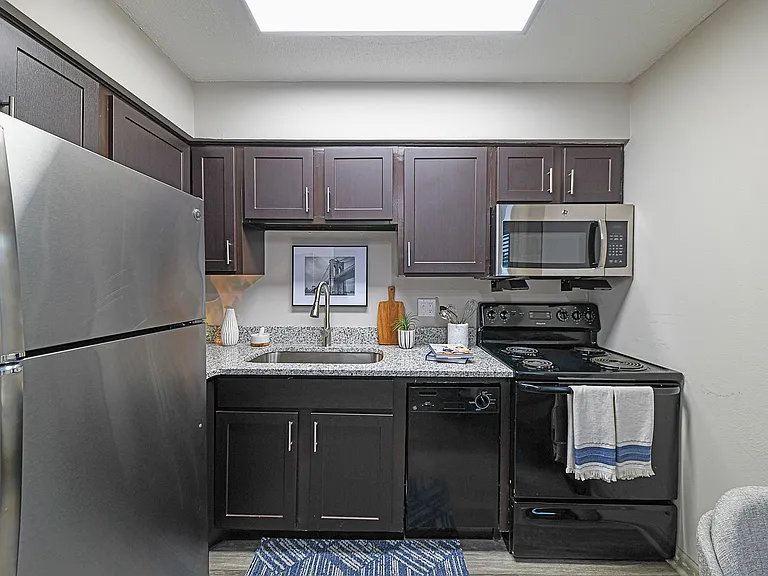 Experience culinary elegance in this modern kitchen, equipped with top-quality appliances and stylish finishes.