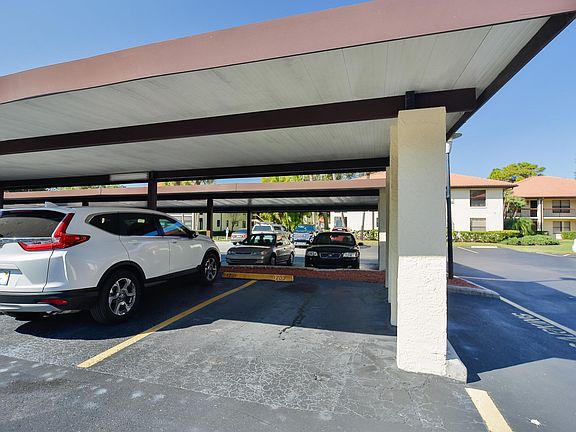 Covered parking space just outside the building.