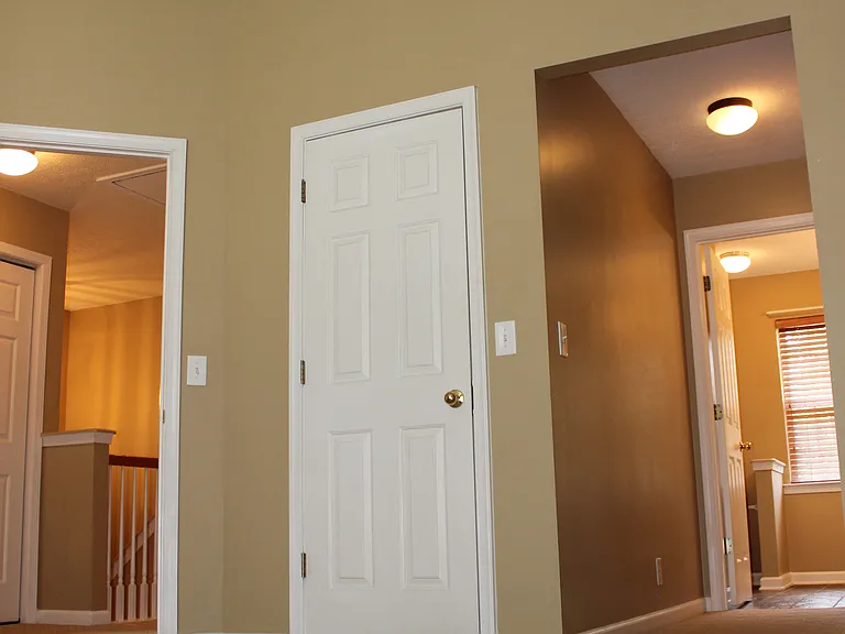 Primary bedroom with vaulted ceilings