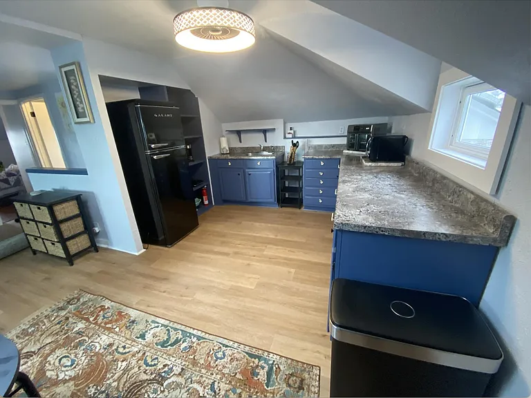 Kitchen opens to sun/living room.
