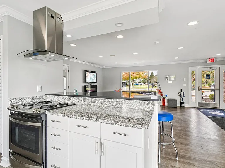 Prepare meals in upgraded kitchens featuring granite countertops and stainless steel appliances, professionally operated by Highlands Vista Group.