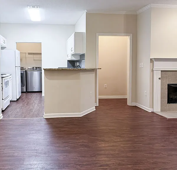 Open floor plan with dining area flowing into kitchen.