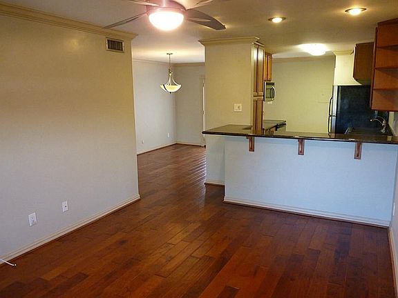 The beautiful hardwood floors extend into the dining area.