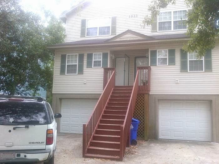 Raised design provides full garage with automatic opener