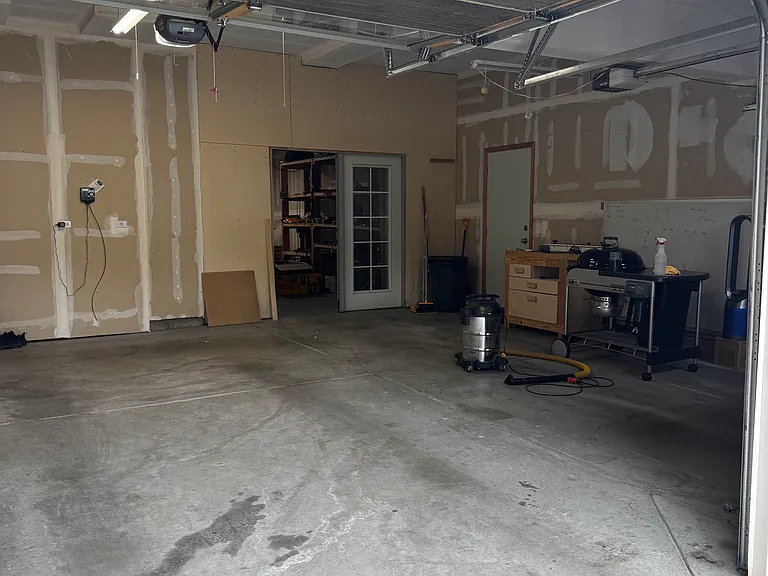garage as it looks from the driveway - 3rd stall where the french door is