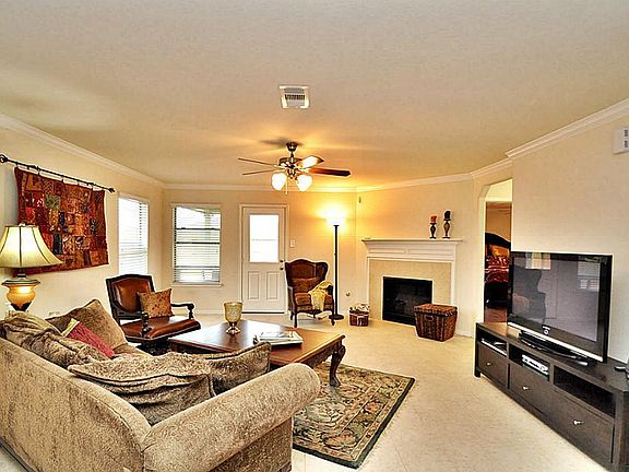 Large family room has a gaslog fireplace