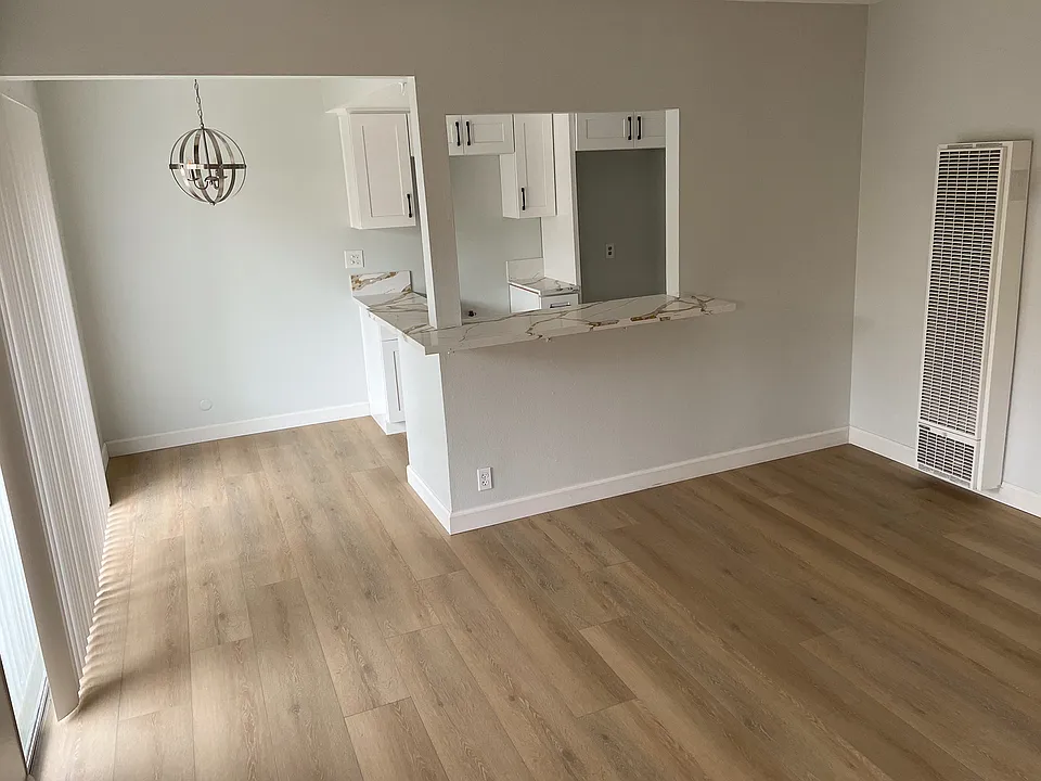 Lots of natural light. Spacious unit with large living room, dining area, breakfast bar and large glass patio windows.