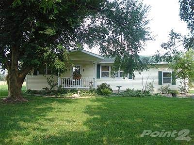 Adorable Cottage on three Acres with large shade trees....remind you of the wholesome goodness of yesteryear, but in an updated fashion!  Maint. free siding, covered porch.....beautiful interior colors!  Peaceful country feel, but close in!